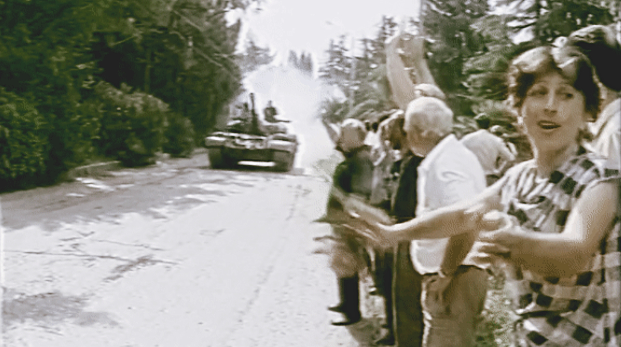 Georgians in Abkhazia welcoming the Georgian invading soldiers with flowers. 14 August 1992.