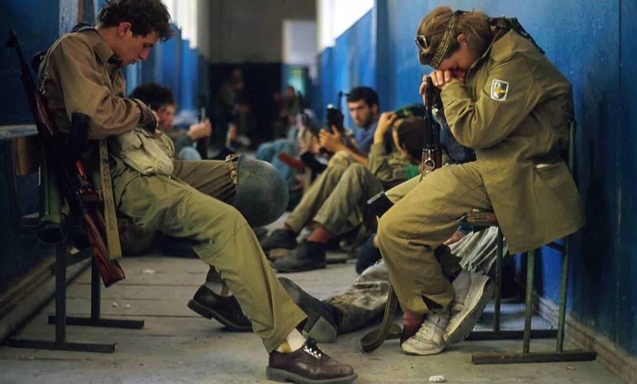 Abkhazian fighters sit in a hallway. September, 1993. 