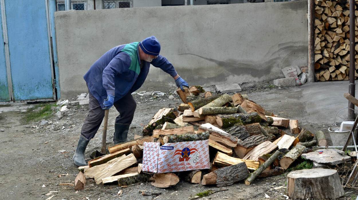 A man chops wood in Stepanakert.