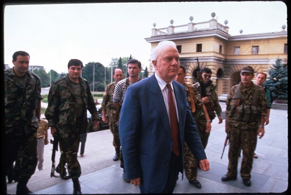 Georgian president Eduard Shevardnadze stands with soldiers at the parliament building. September, 1993. Sukhum, Abkhazia.