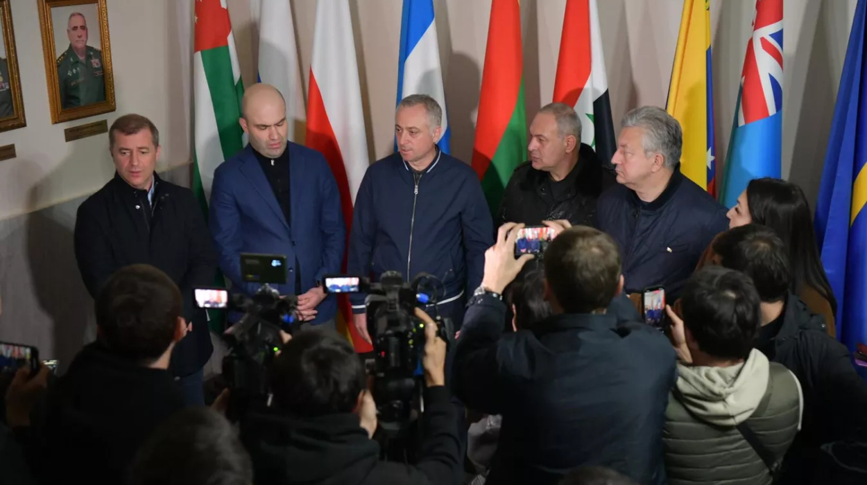 Opposition and government representatives address the press following marathon negotiations.