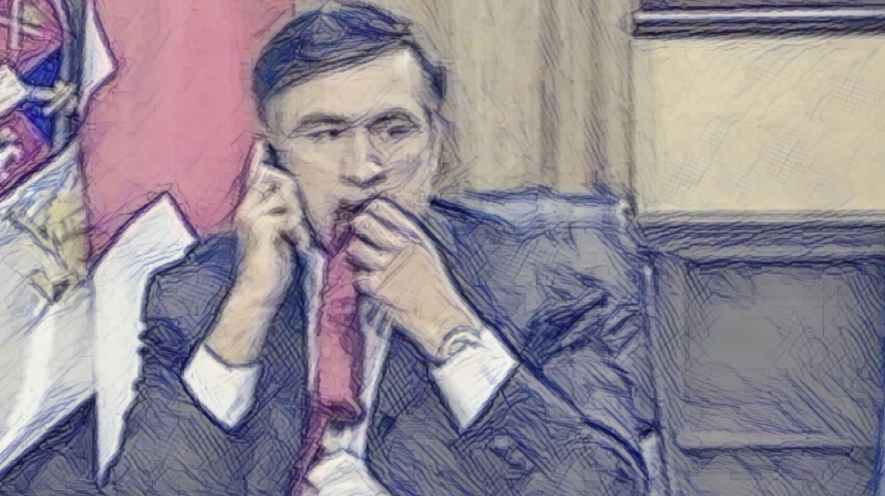 Saakashvili chewing his tie (BBC News).