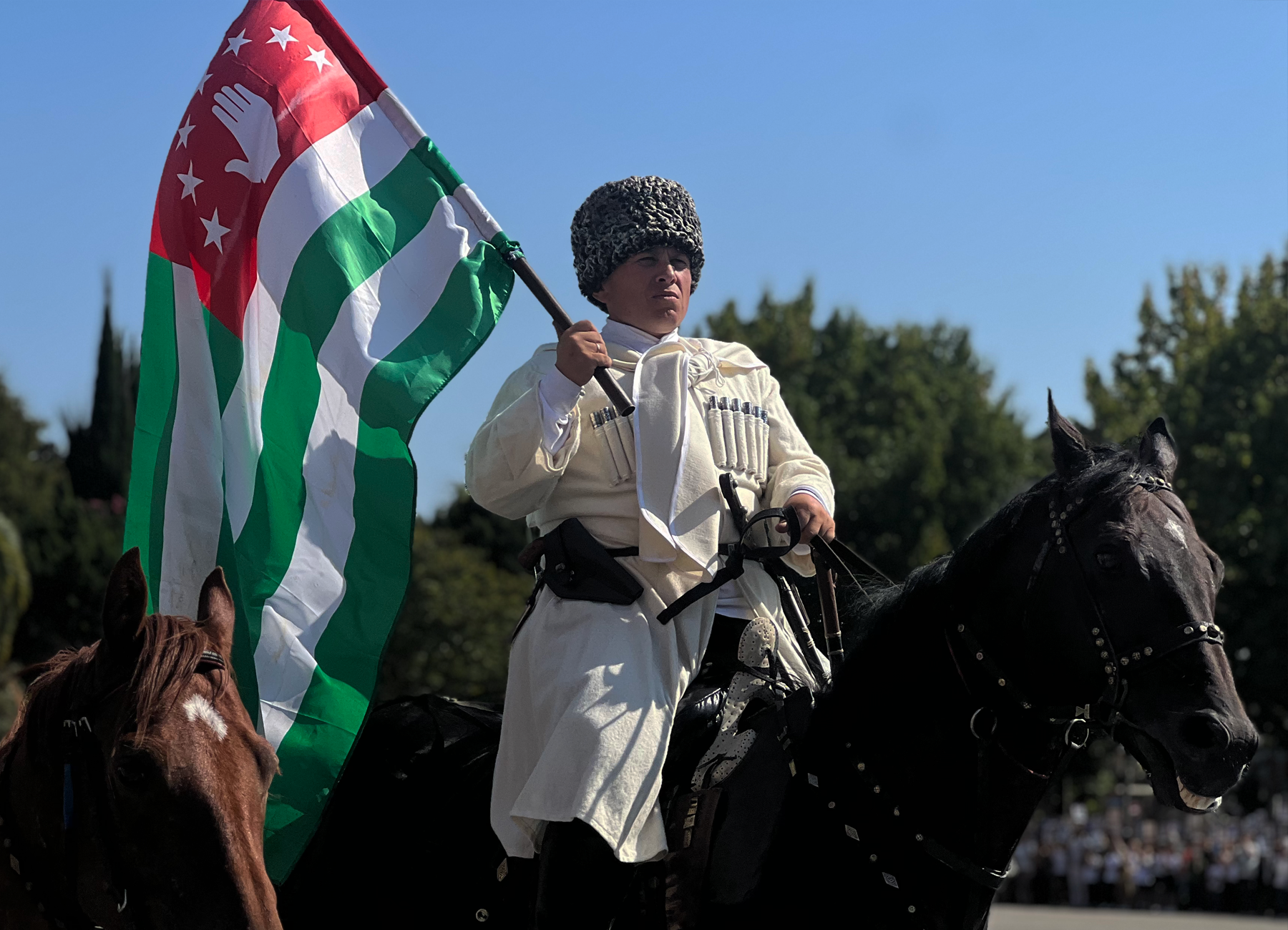 Abkhaz man with the flag of Abkhazia